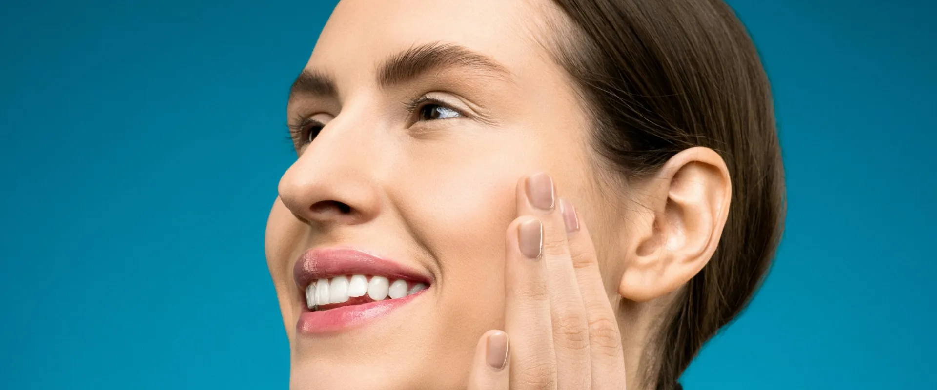 Bright white smile after professional teeth whitening at Tribute Family Dentistry in Frisco TX 75034 and 75036