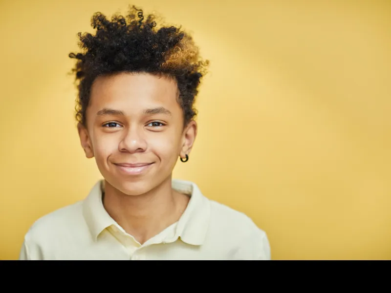 Smiling Teen Boy Visiting Tribute Family Dentistry in Frisco TX