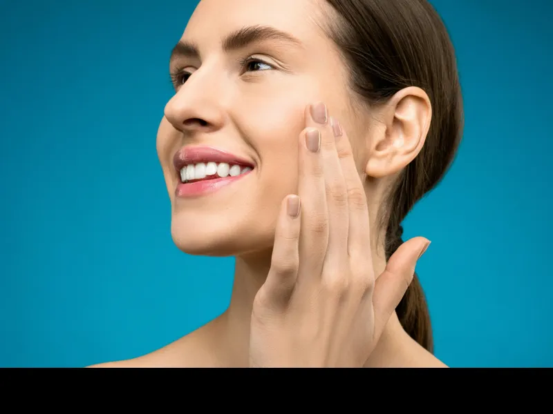 Bright white smile after professional teeth whitening at Tribute Family Dentistry in Frisco TX 75034 and 75036