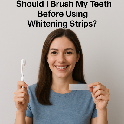 Smiling woman in Frisco tx 75034 holding a toothbrush in one hand and a whitening strip in the other, with text asking if you should brush before using whitening strips.